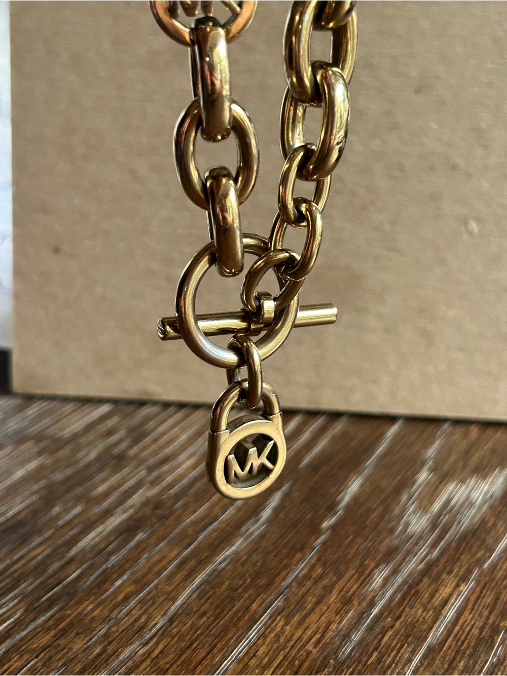 Michael Kors Gold color chunky Link Chain Bracelet with MK Toggle/Charm